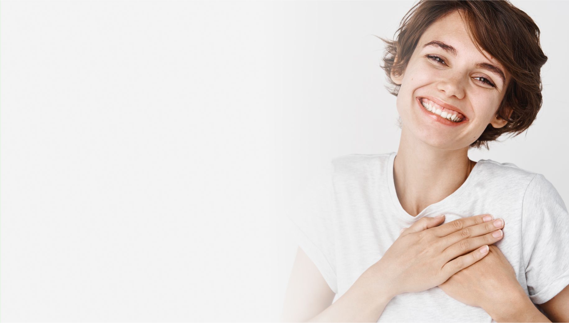 Banner image for igital thank you cards, showing person smiling and holding hands over heart