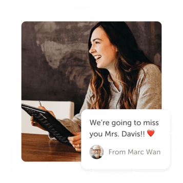 Smiling teacher with tablet and a "we'll miss you" post