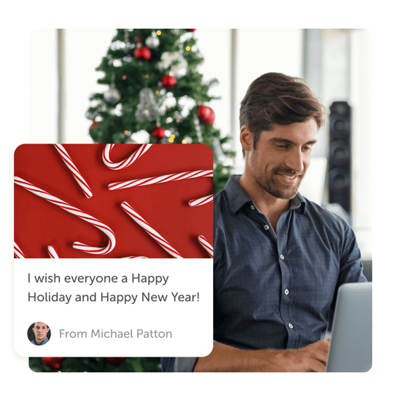 Man smiling with Christmas tree in background and a "happy holidays" post