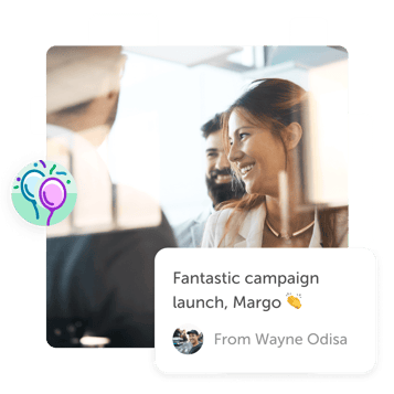 People in office smiling at Kudoboard post that reads 'fantastic campaign launch'
