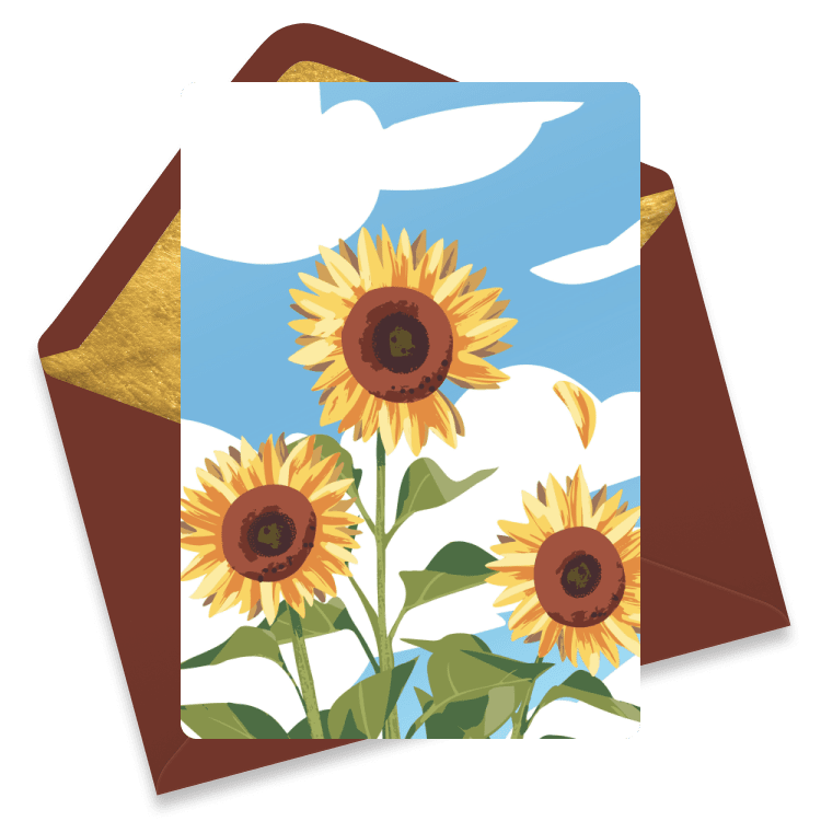 A card with tall blooming sunflowers against a blue sky and clouds.
